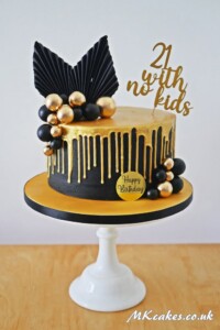 Gold and Black dripping cake Gold and Black dripping cake